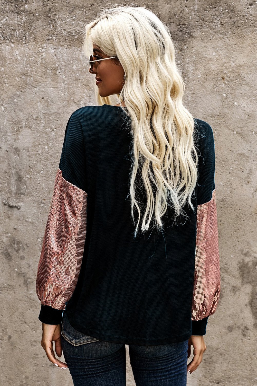 A stylish Sequin Splicing V Neck Bishop Sleeves Top featuring shimmering sequins on bishop sleeves and a fashionable sequined pocket.