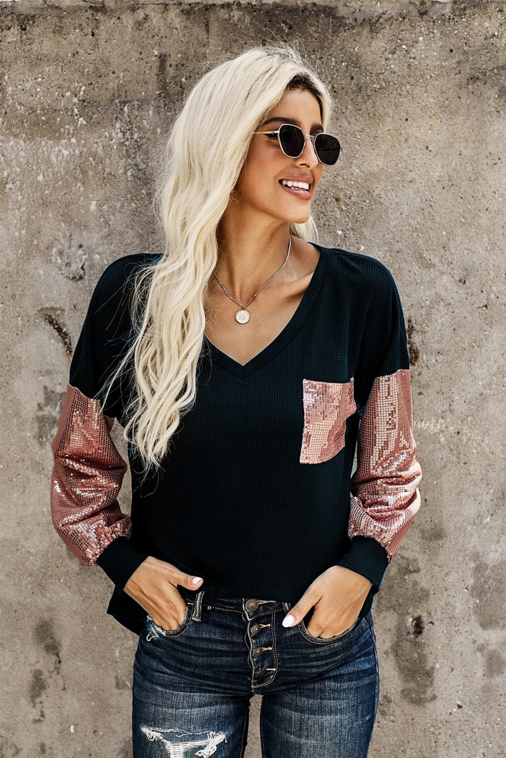 A stylish Sequin Splicing V Neck Bishop Sleeves Top featuring shimmering sequins on bishop sleeves and a fashionable sequined pocket.