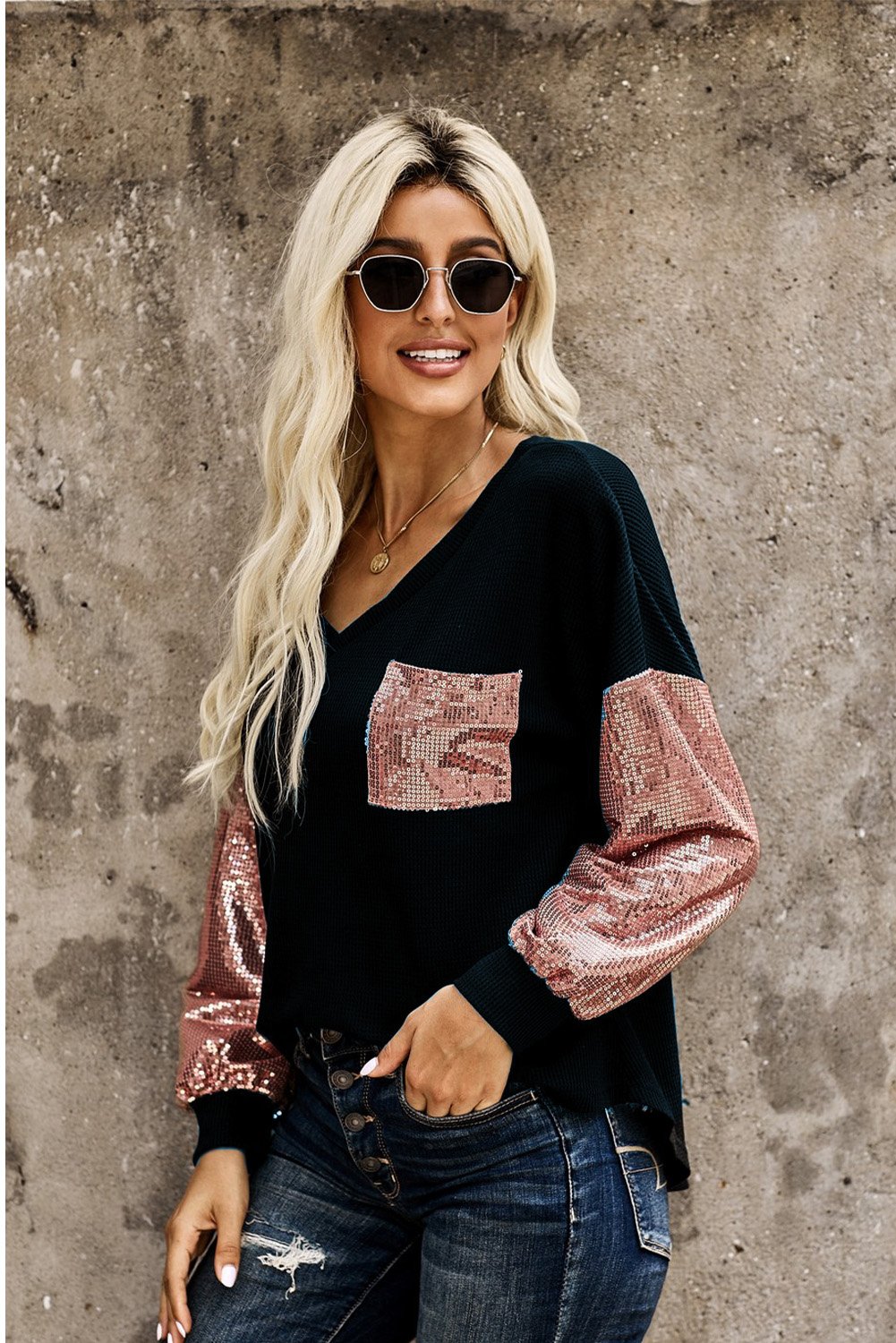 A stylish Sequin Splicing V Neck Bishop Sleeves Top featuring shimmering sequins on bishop sleeves and a fashionable sequined pocket.