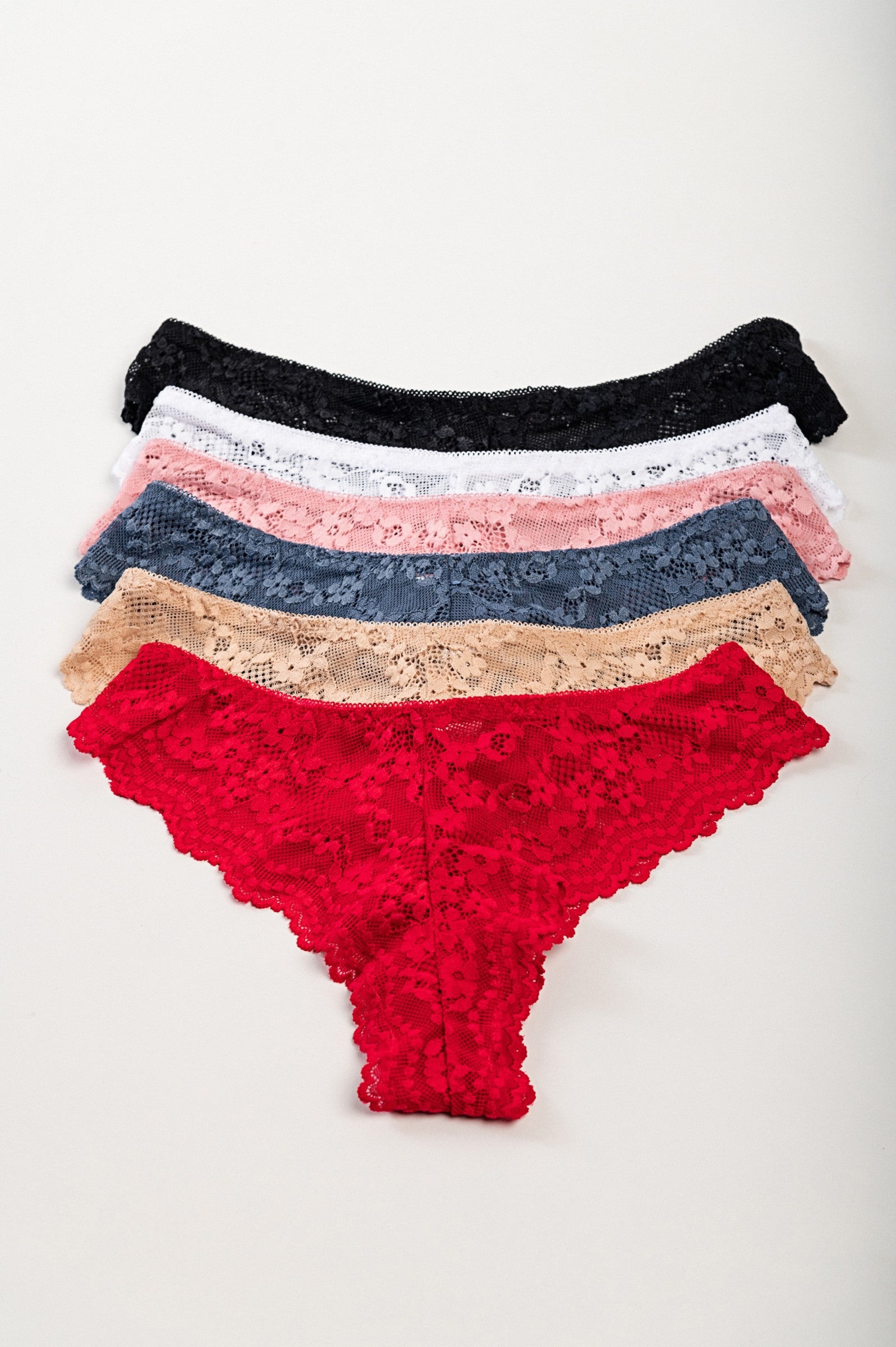 Set of 6 lace panties in various colors including white, black, beige, red, pink, and blue, showcasing their delicate lace design.