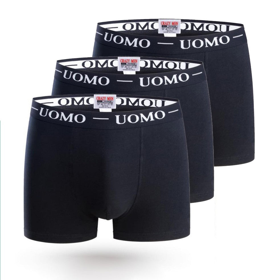 Set of three men's black cotton boxers, showcasing a fitted design and soft fabric.