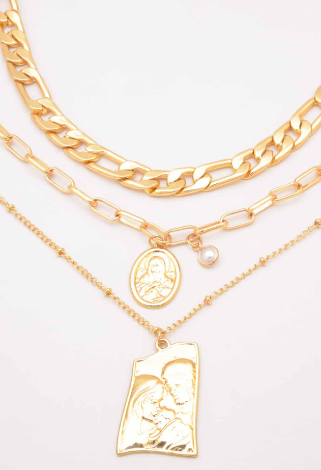 Set of three gold color pendant necklaces with chain links, showcasing elegant designs and unique pendants.