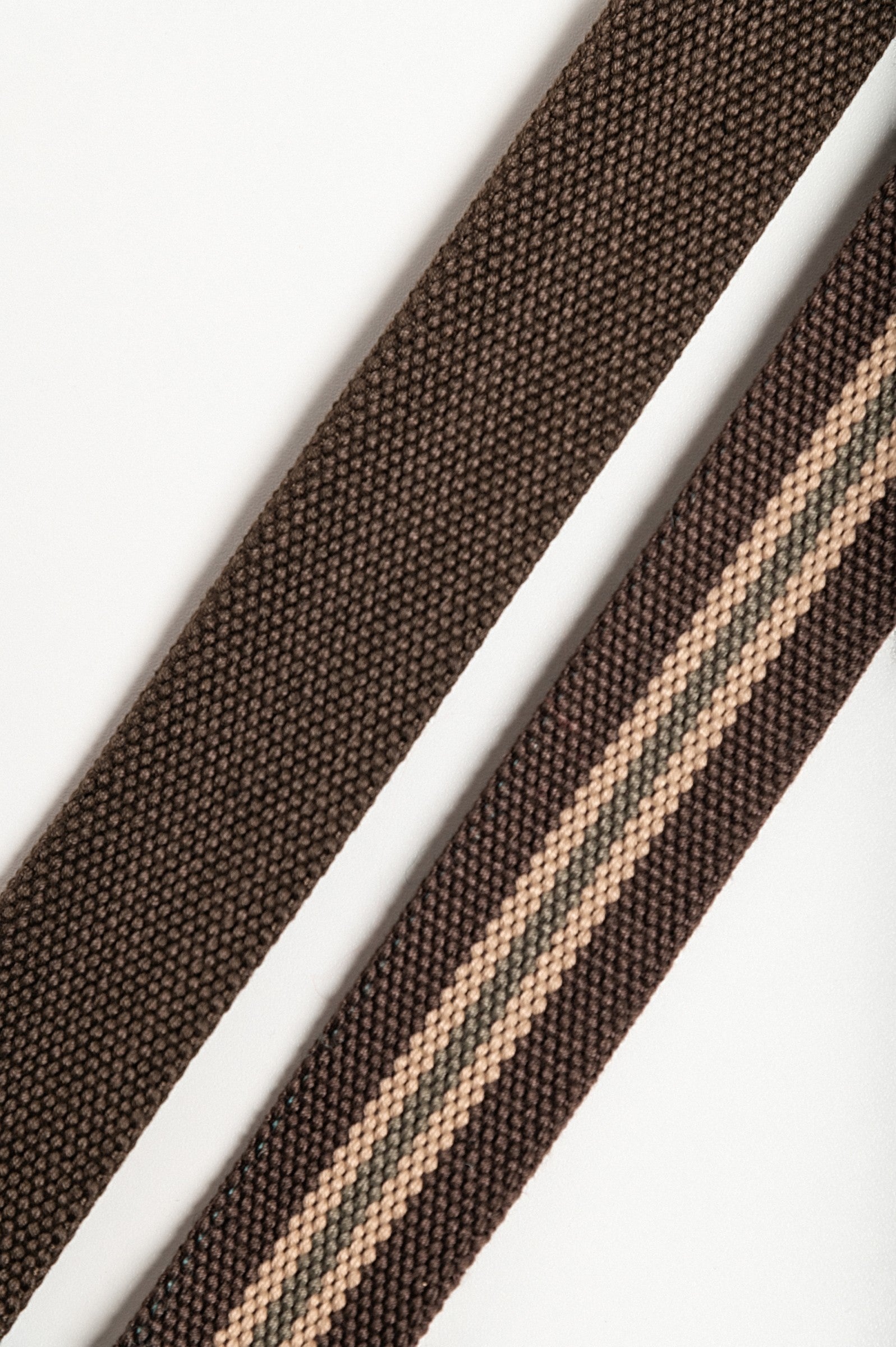 Set of two multicolored belts with metal buckle, featuring a classic brown and striped brown design.