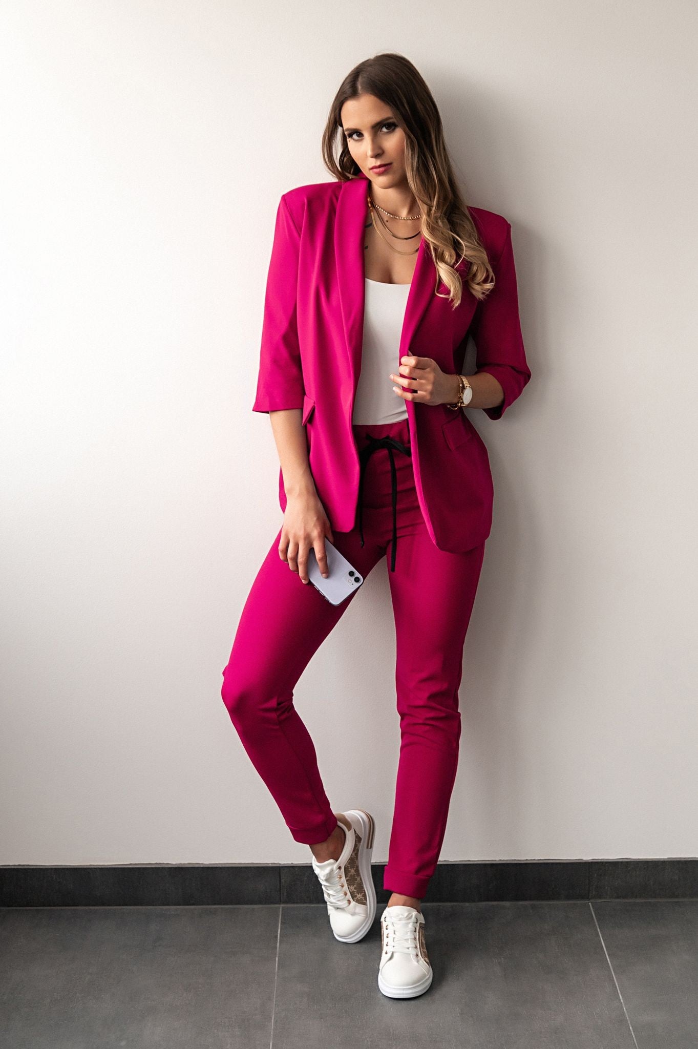 Elegant fuchsia blazer and pants set with 3/4 sleeves, showcasing a classic collar and fitted design.