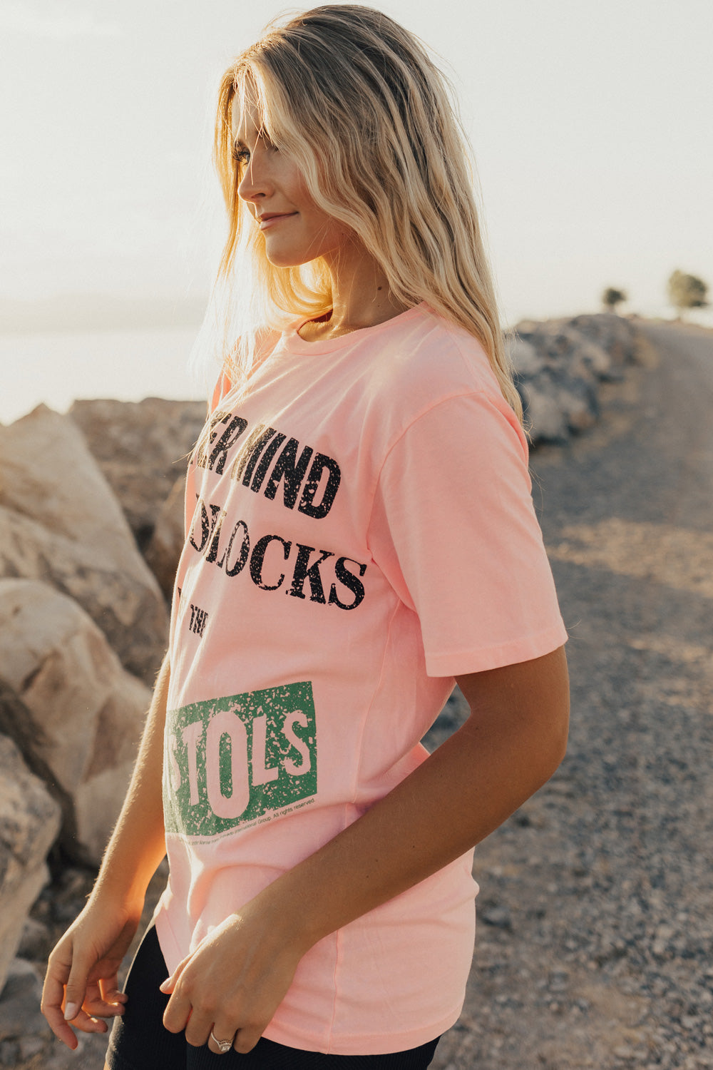 A vibrant pink Sex Pistols Never Mind The Bollocks Tee made from 100% organic cotton, featuring bold graphics and a modern cut.