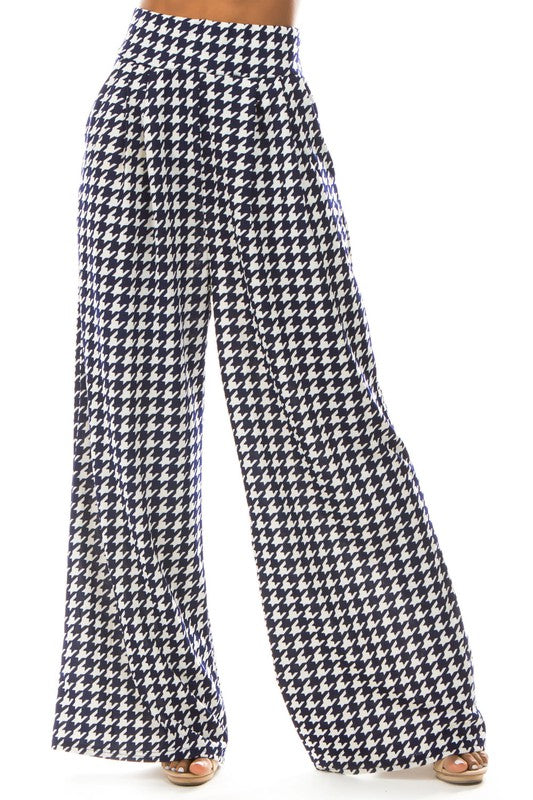 A pair of sexy multi-print palazzo pants featuring an elasticized waist and side pockets, perfect for stylish comfort.