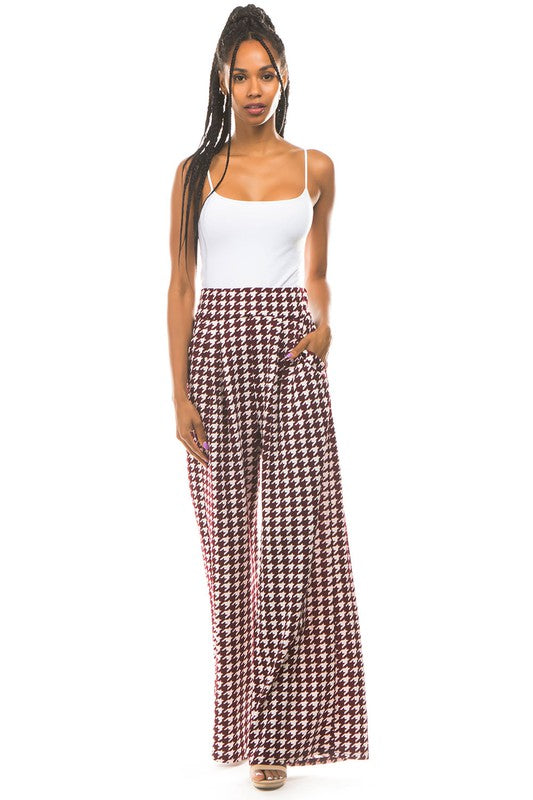 A pair of sexy multi-print palazzo pants featuring an elasticized waist and side pockets, perfect for stylish and comfortable wear.