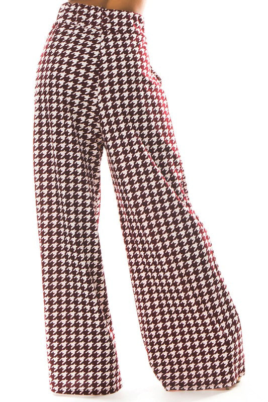 A pair of sexy multi-print palazzo pants featuring an elasticized waist and side pockets, perfect for stylish and comfortable wear.