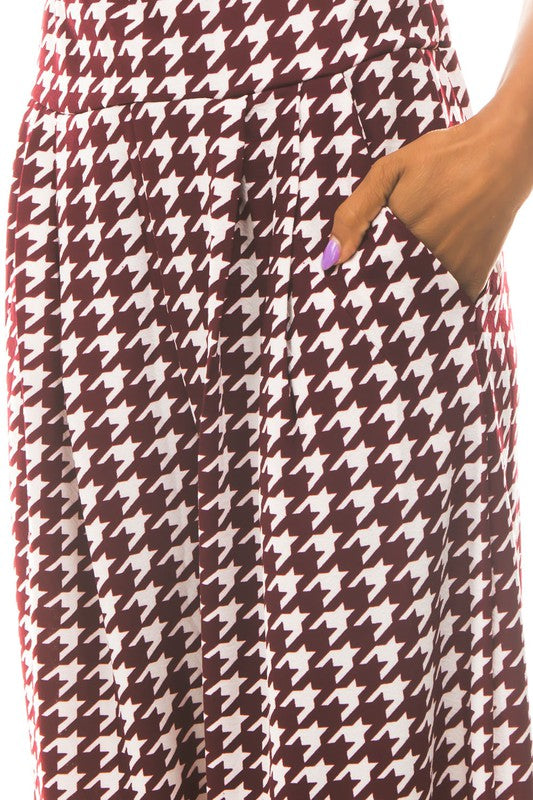 A pair of sexy multi-print palazzo pants featuring an elasticized waist and side pockets, perfect for stylish and comfortable wear.