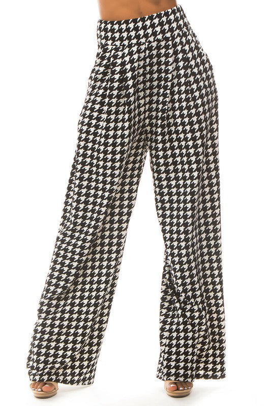 A pair of sexy multi-print palazzo pants featuring an elasticized waist and side pockets, perfect for stylish comfort.