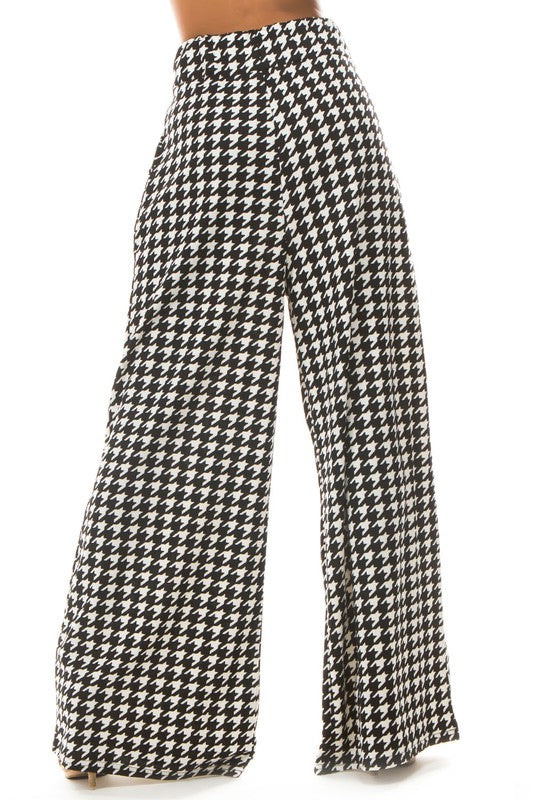 A pair of sexy multi-print palazzo pants featuring an elasticized waist and side pockets, perfect for stylish comfort.