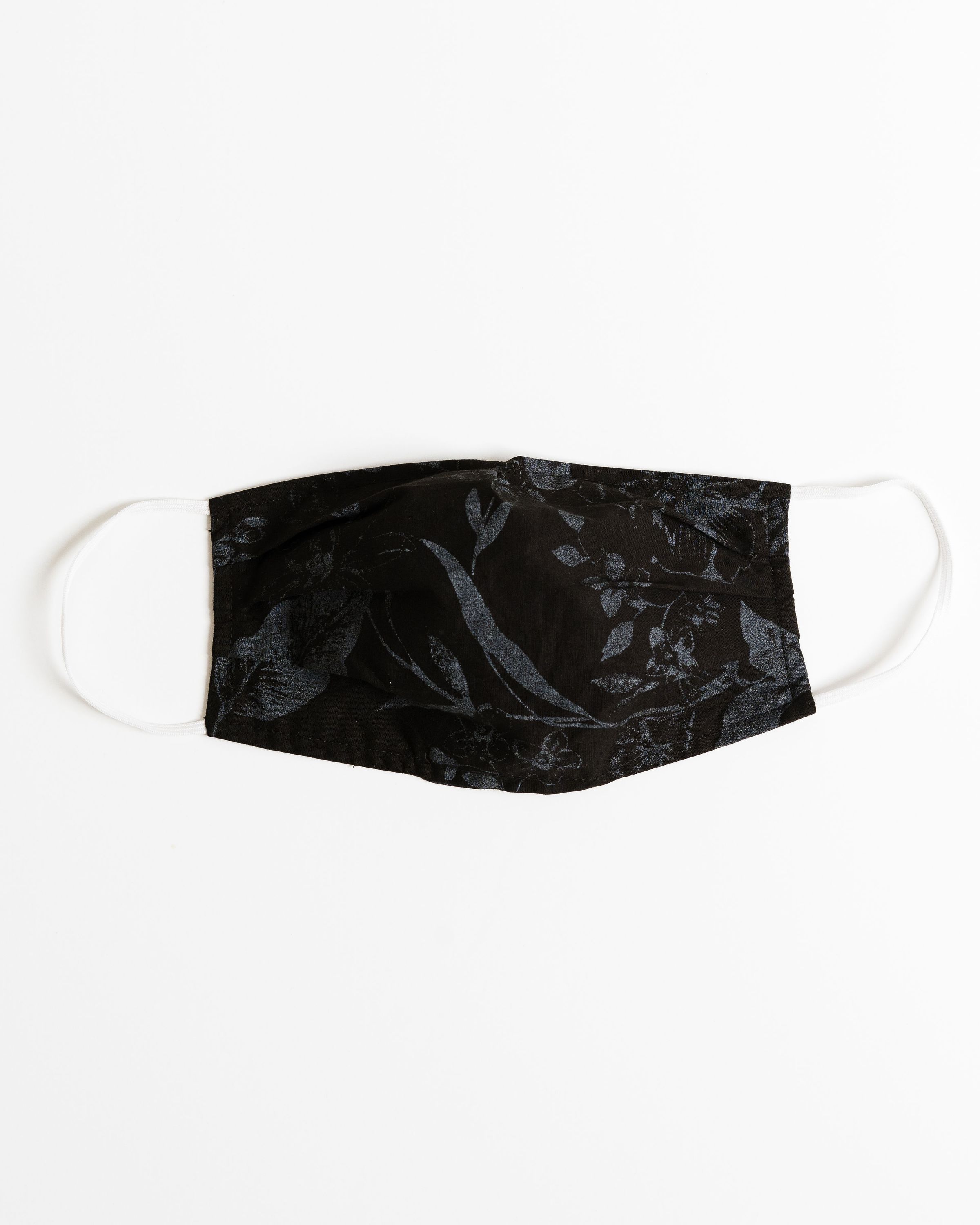 Shadow Floral Face Mask made of breathable cotton with floral design, featuring pleats for comfort and a pocket for filter insertion.