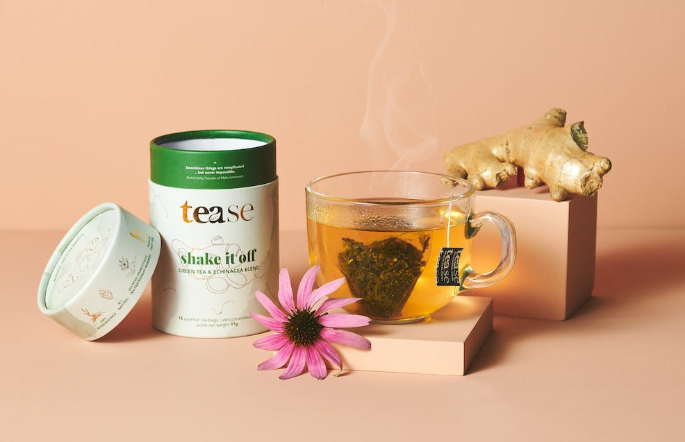 Shake It Off Immunity Tea Blend tube with pyramid tea bags, featuring echinacea and ginger ingredients.