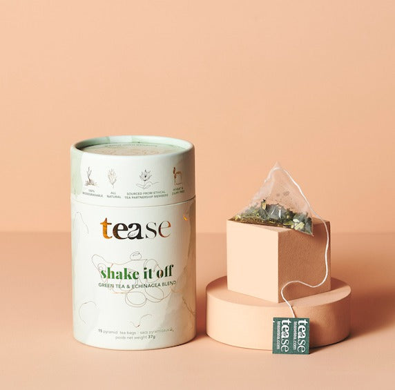 Shake It Off Immunity Tea Blend tube with pyramid tea bags, featuring echinacea and ginger ingredients.