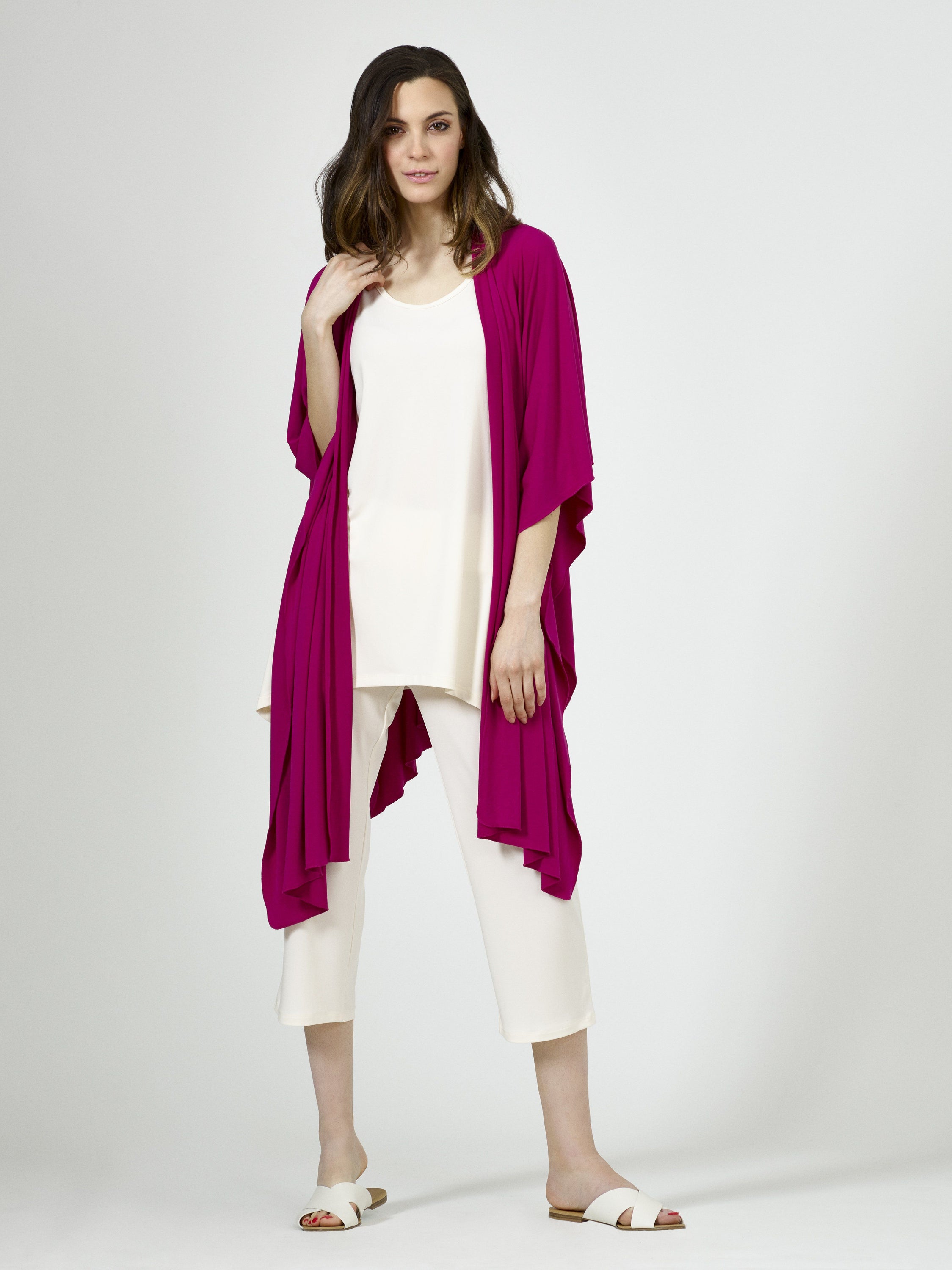 A stylish Shawl Textured Mesh Knit draped elegantly, showcasing its soft texture and versatile design, perfect for layering.