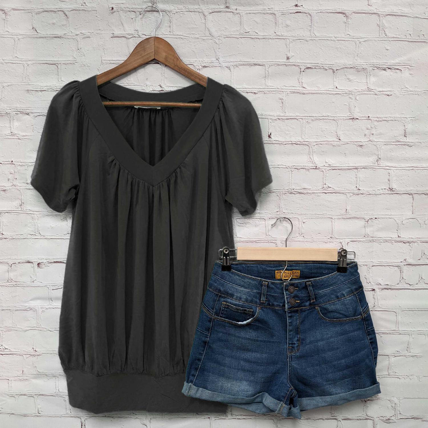 A stylish Shirred V-neck Short Sleeve Top featuring a pleated design and fitted elastic waistband, available in various colors.