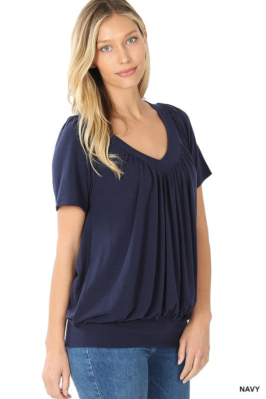 A stylish Shirred V-neck Short Sleeve Top featuring a pleated design and fitted elastic waistband, available in various colors.