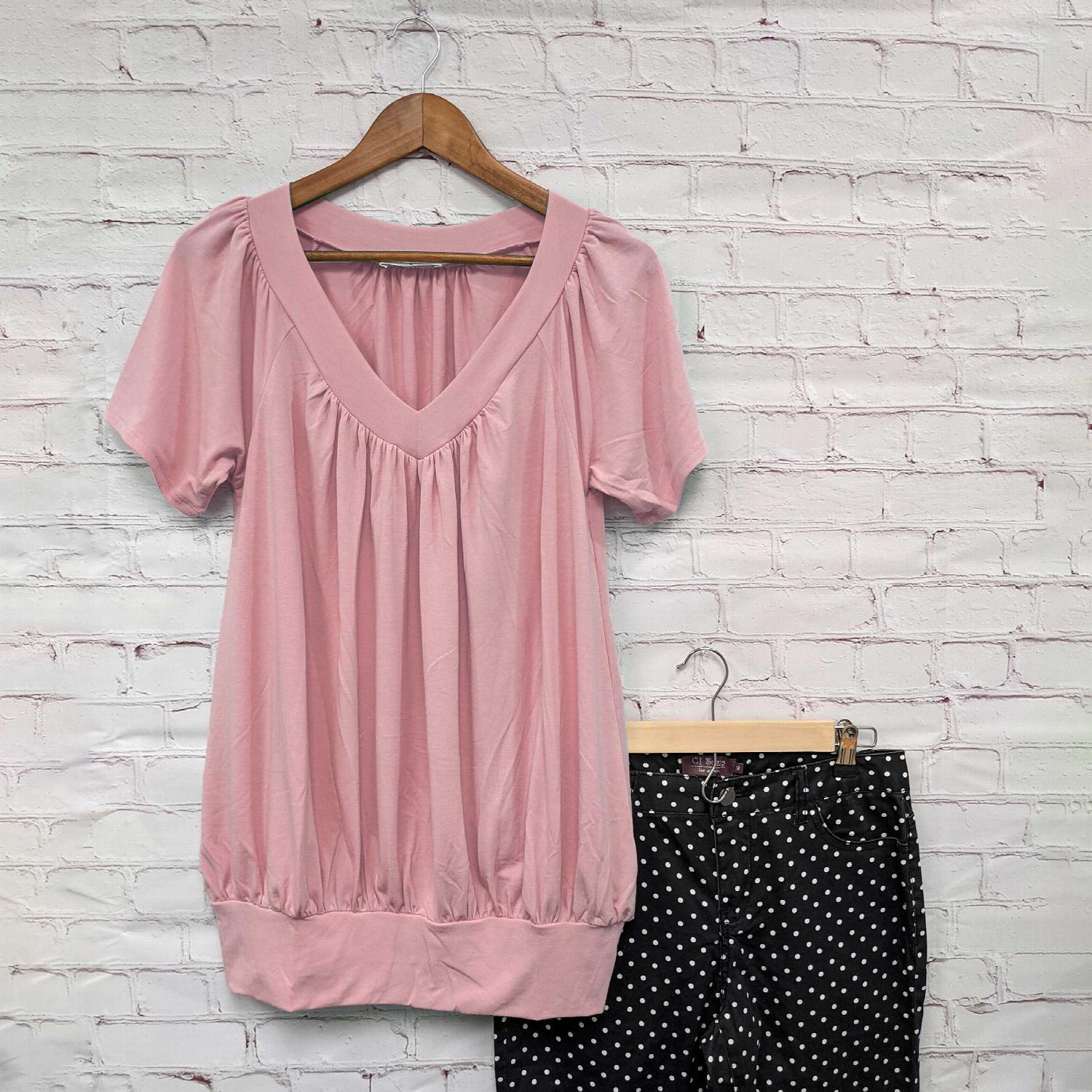 A stylish Shirred V-neck Short Sleeve Top featuring a pleated design and fitted elastic waistband, available in various colors.