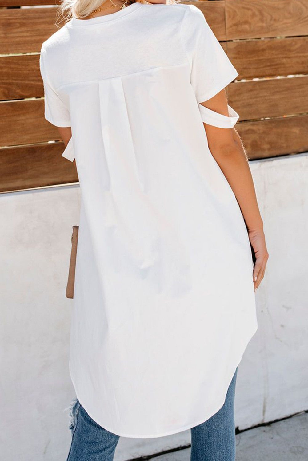 Elegant white SHIRT VEBTURA with round collar and short sleeves, featuring an asymmetric length design.