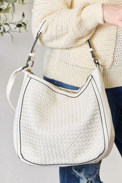 SHOMICO Weaved Vegan Leather Handbag showcasing intricate weaving and a stylish crossbody strap.