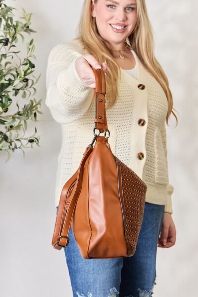 SHOMICO Weaved Vegan Leather Handbag showcasing intricate weaving and a stylish crossbody strap.