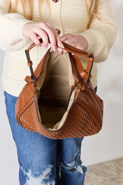 SHOMICO Weaved Vegan Leather Handbag showcasing intricate weaving and a stylish crossbody strap.