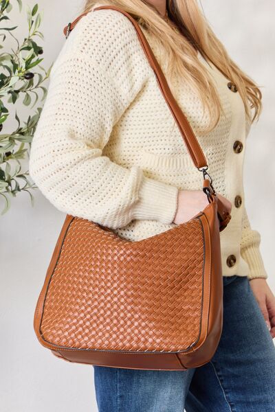 SHOMICO Weaved Vegan Leather Handbag showcasing intricate weaving and a stylish crossbody strap.