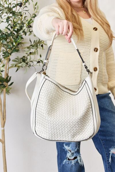 SHOMICO Weaved Vegan Leather Handbag showcasing intricate weaving and a stylish crossbody strap.