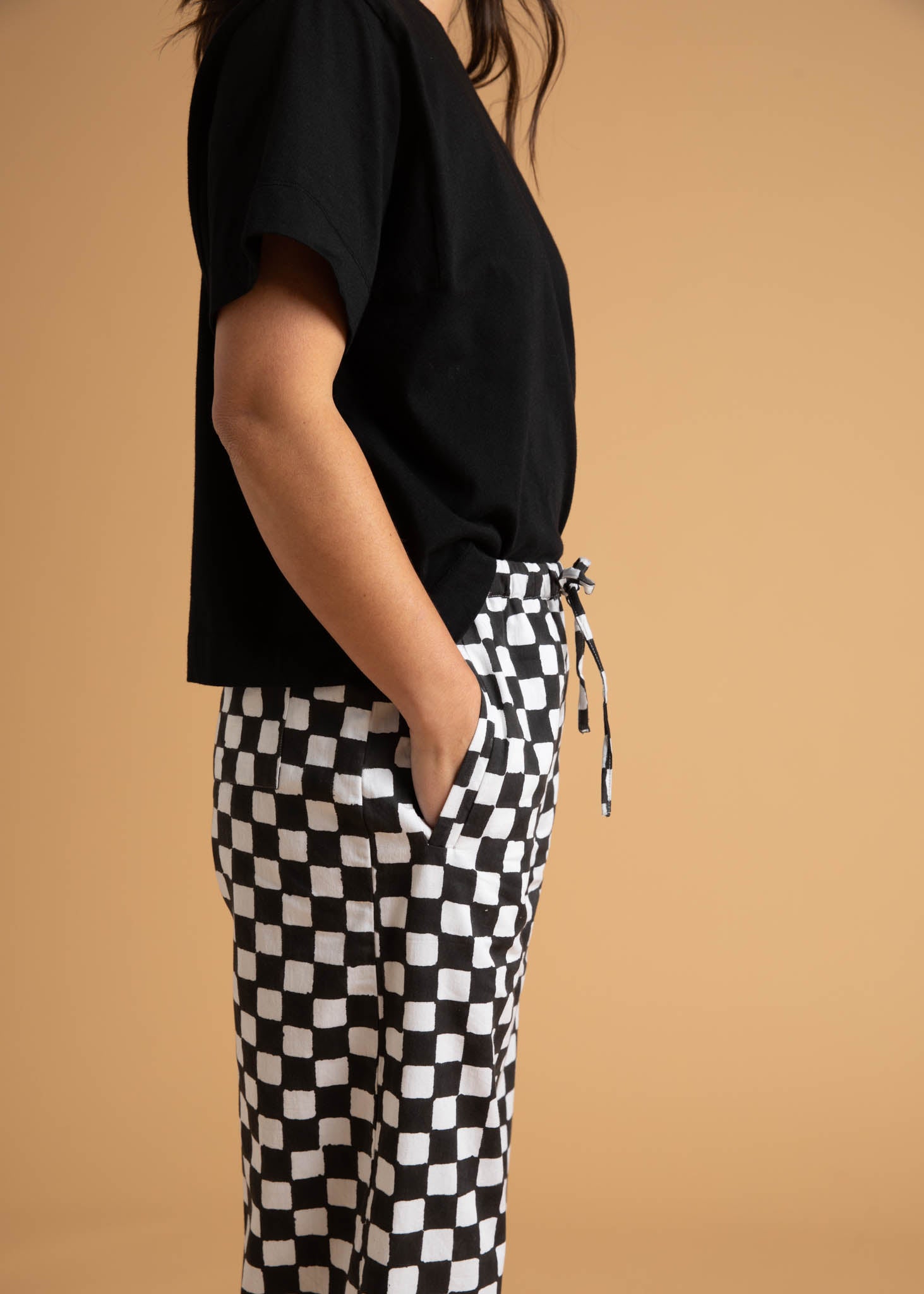 Shore Pant in Checkerboard Black featuring a modern cropped length and relaxed fit, made from sustainable organic cotton.