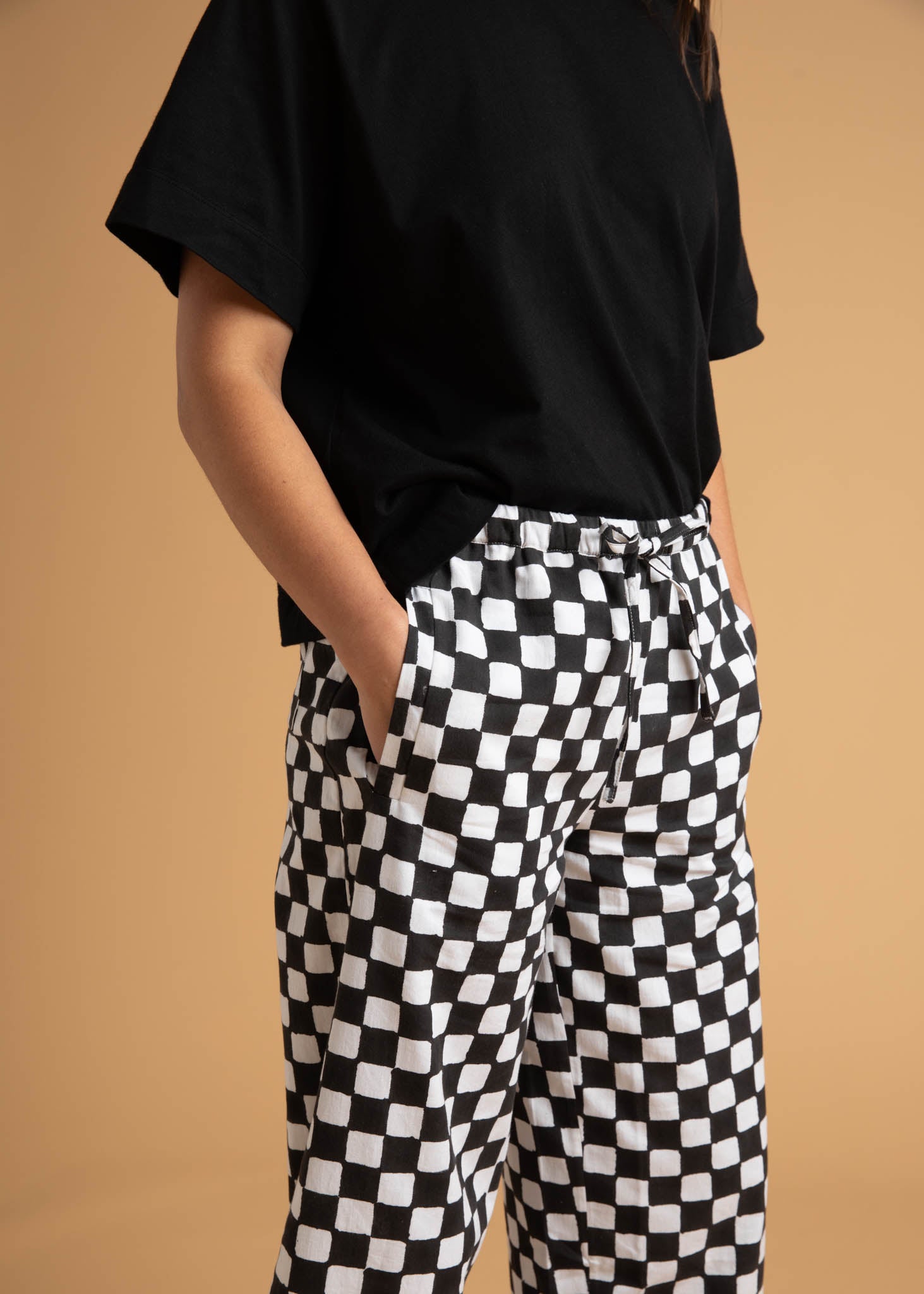 Shore Pant in Checkerboard Black featuring a modern cropped length and relaxed fit, made from sustainable organic cotton.