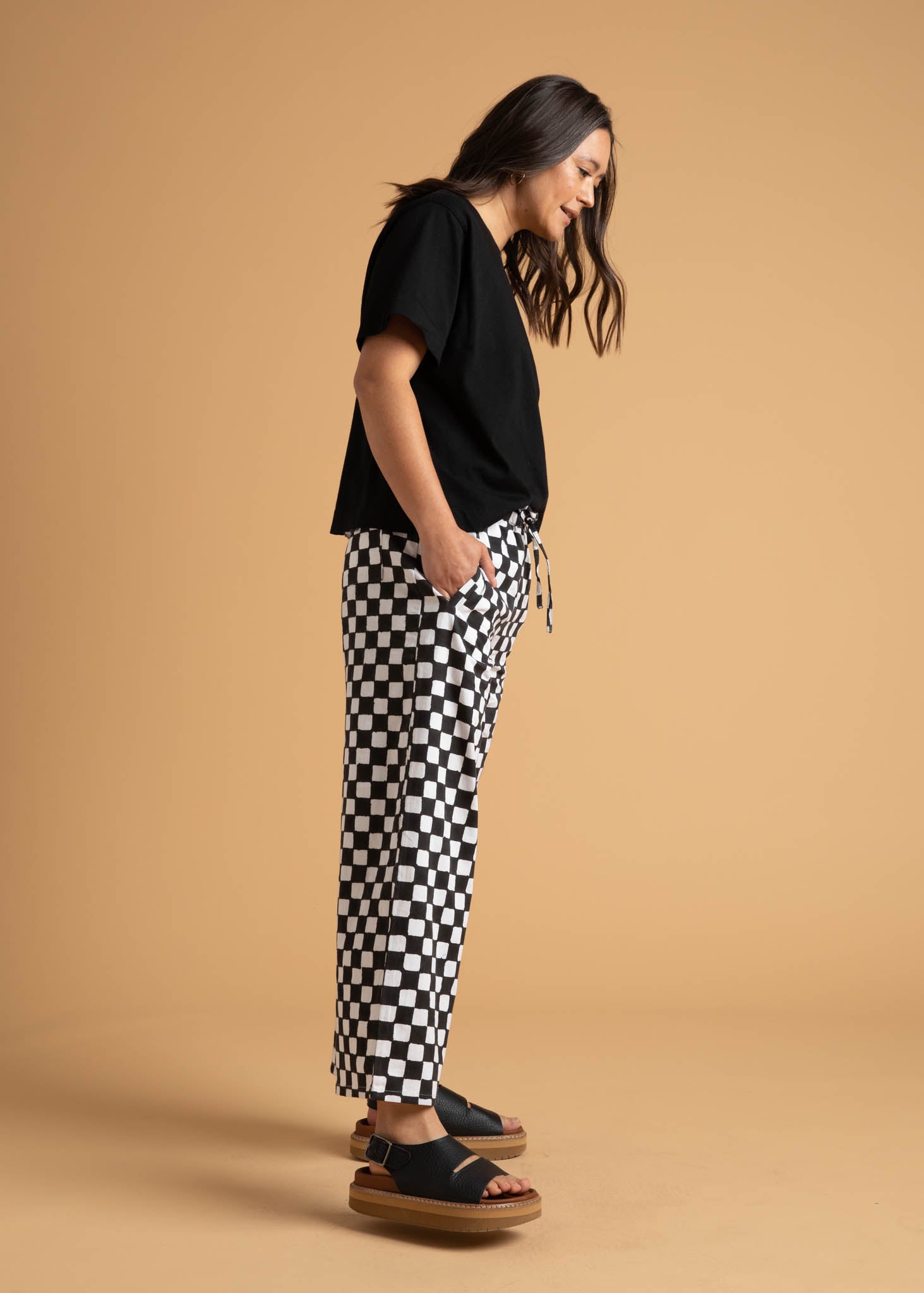 Shore Pant in Checkerboard Black featuring a modern cropped length and relaxed fit, made from sustainable organic cotton.