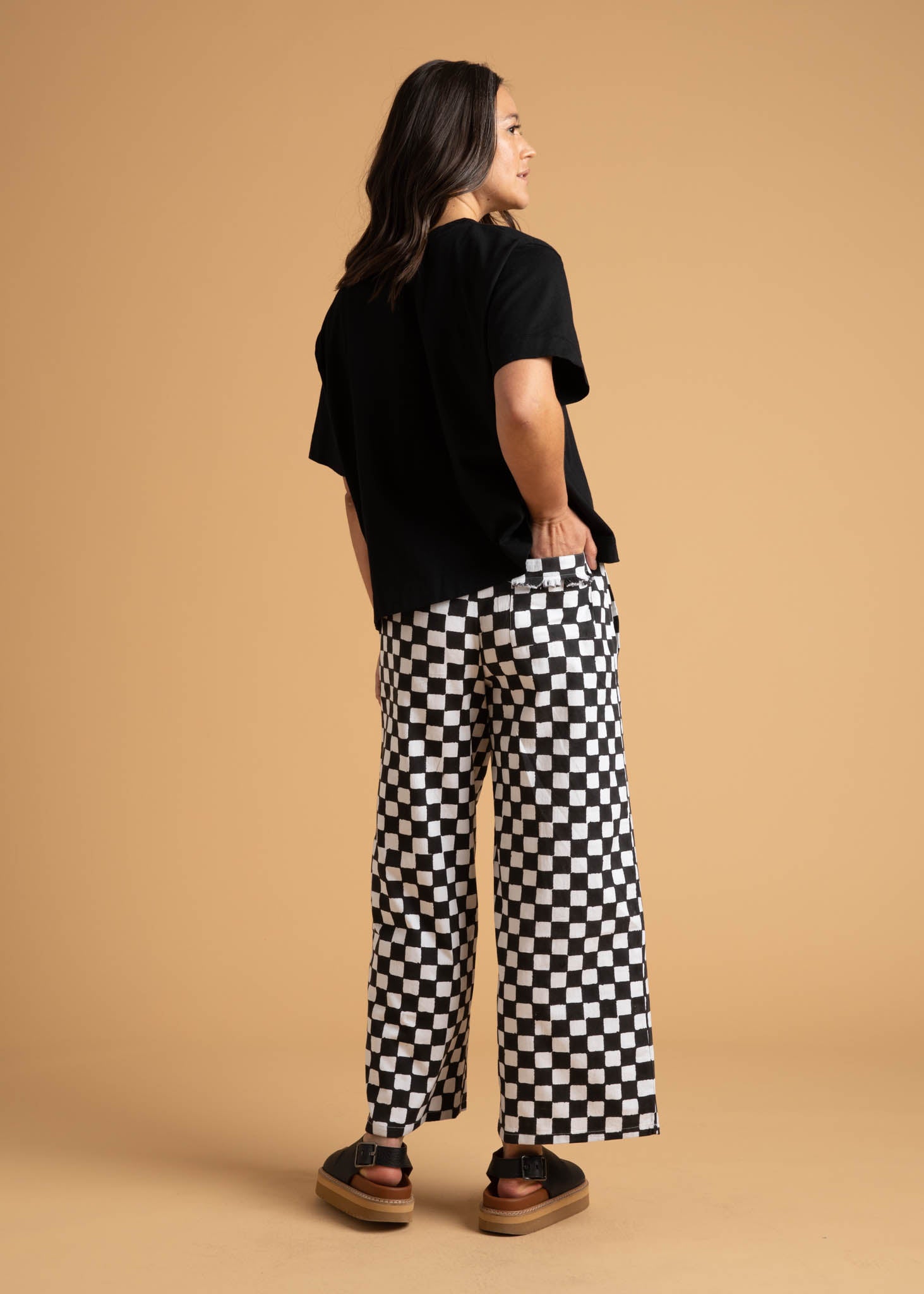 Shore Pant in Checkerboard Black featuring a modern cropped length and relaxed fit, made from sustainable organic cotton.