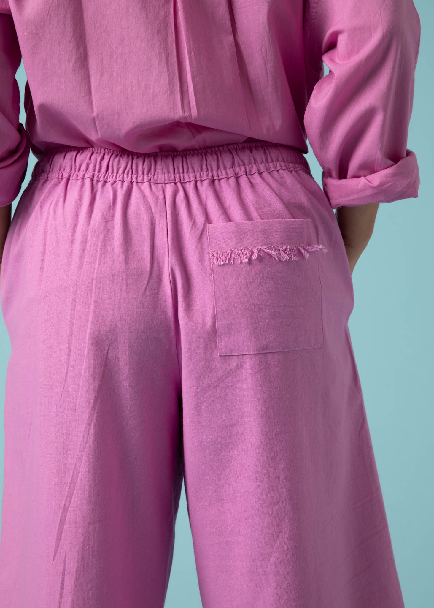 Shore Pant in Dahlia featuring a modern cropped length, relaxed fit, and elastic waist, made from organic cotton twill.