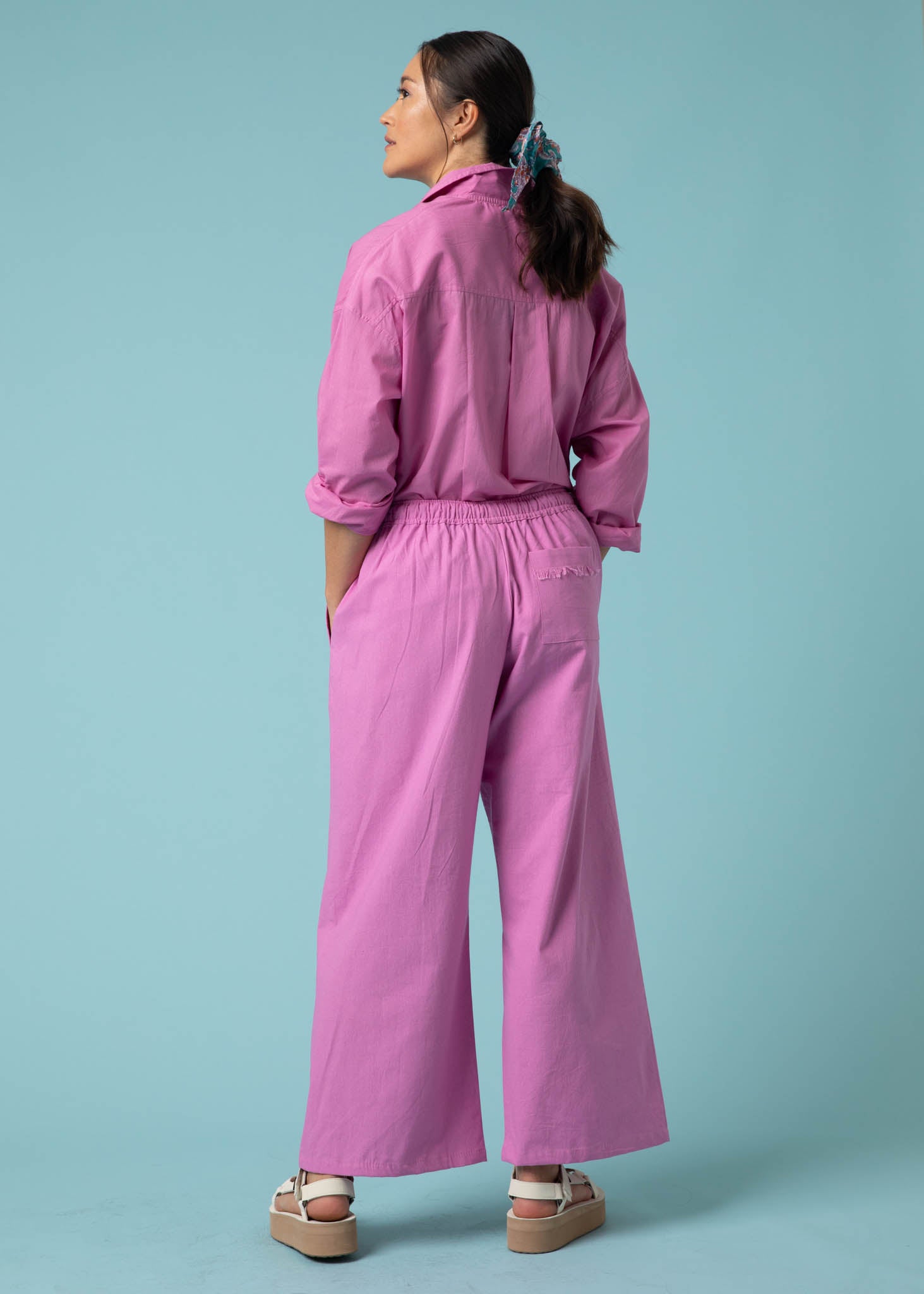 Shore Pant in Dahlia featuring a modern cropped length, relaxed fit, and elastic waist, made from organic cotton twill.