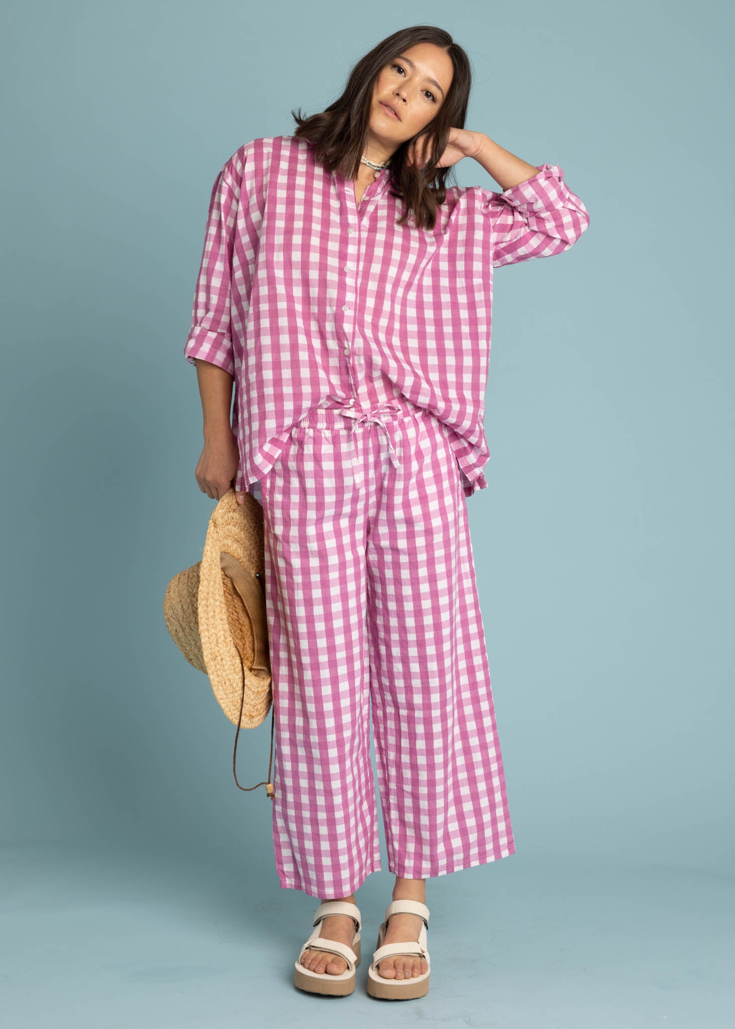 Shore Pant in Gingham Picnic Dahlia featuring a modern cropped length and relaxed fit, made from organic cotton.