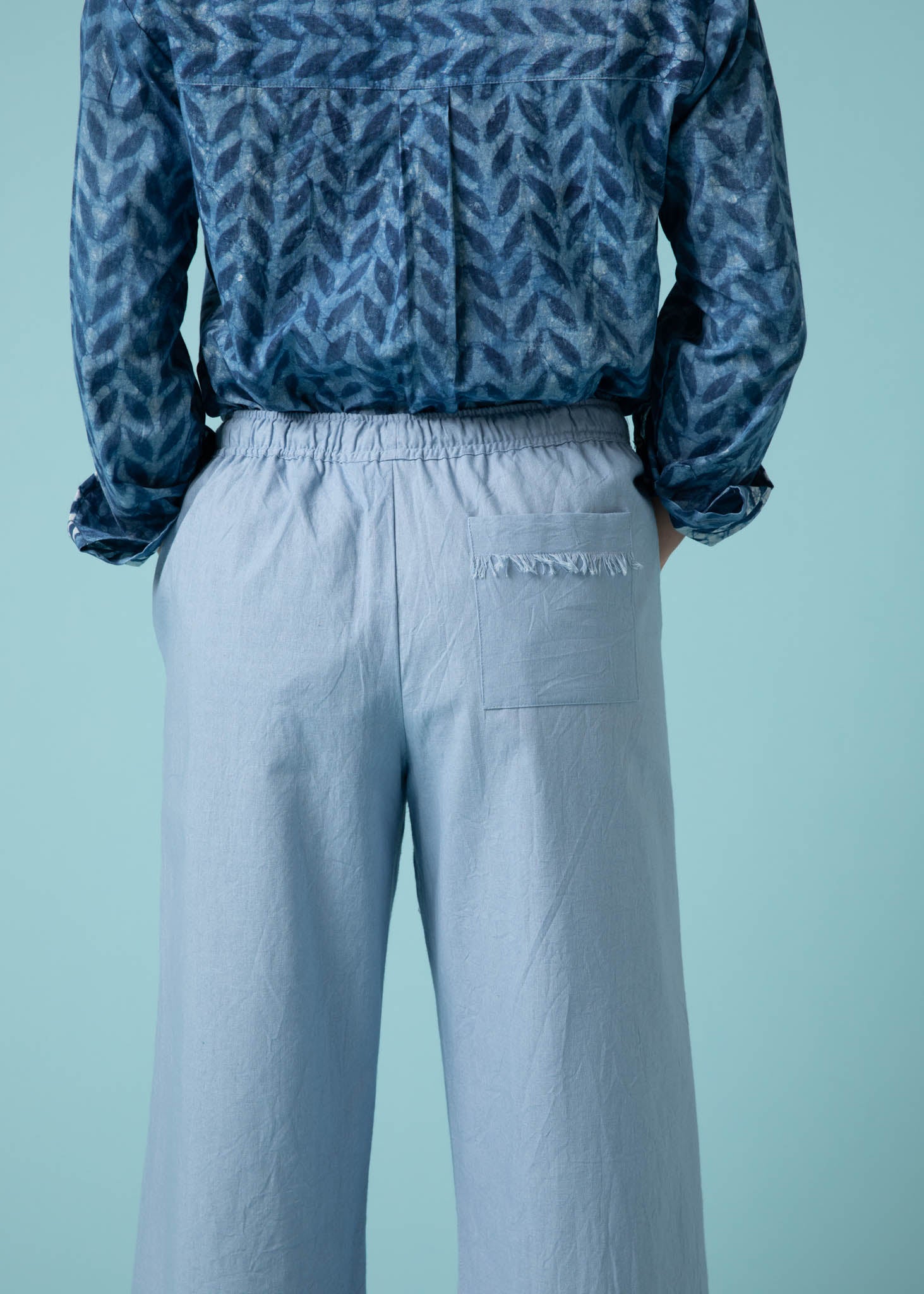 Shore Pant in Sky, featuring a modern cropped length, relaxed fit, and elastic waist, made from organic cotton twill.