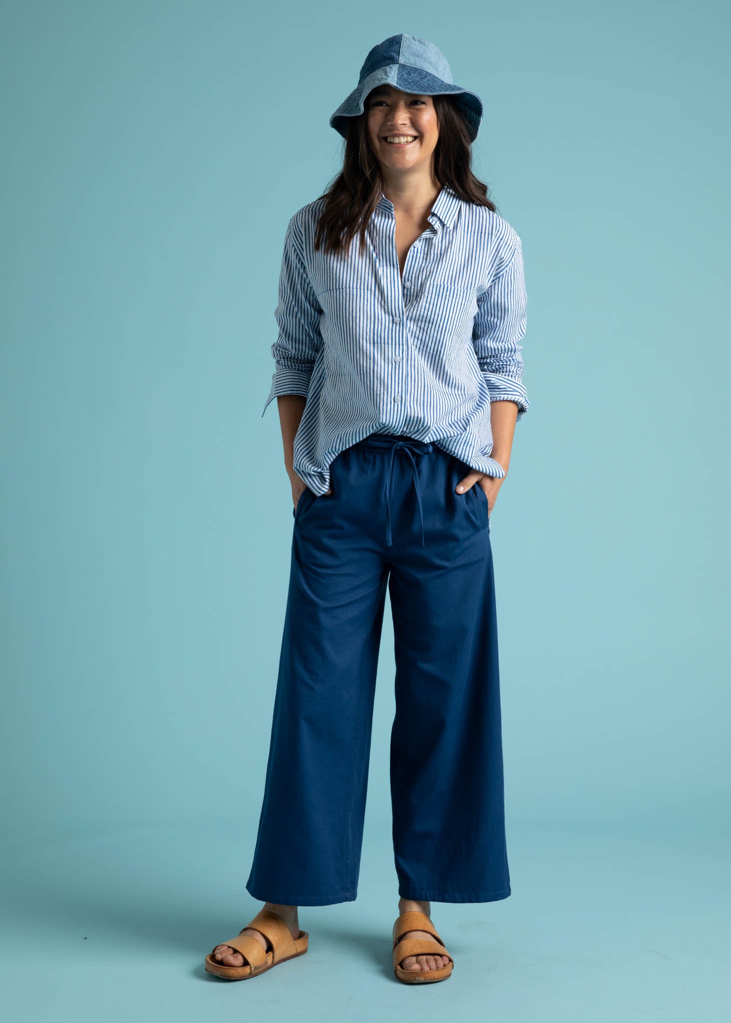 Shore Pant in True Navy featuring a relaxed fit, cropped length, and elastic waist, displayed on a model.