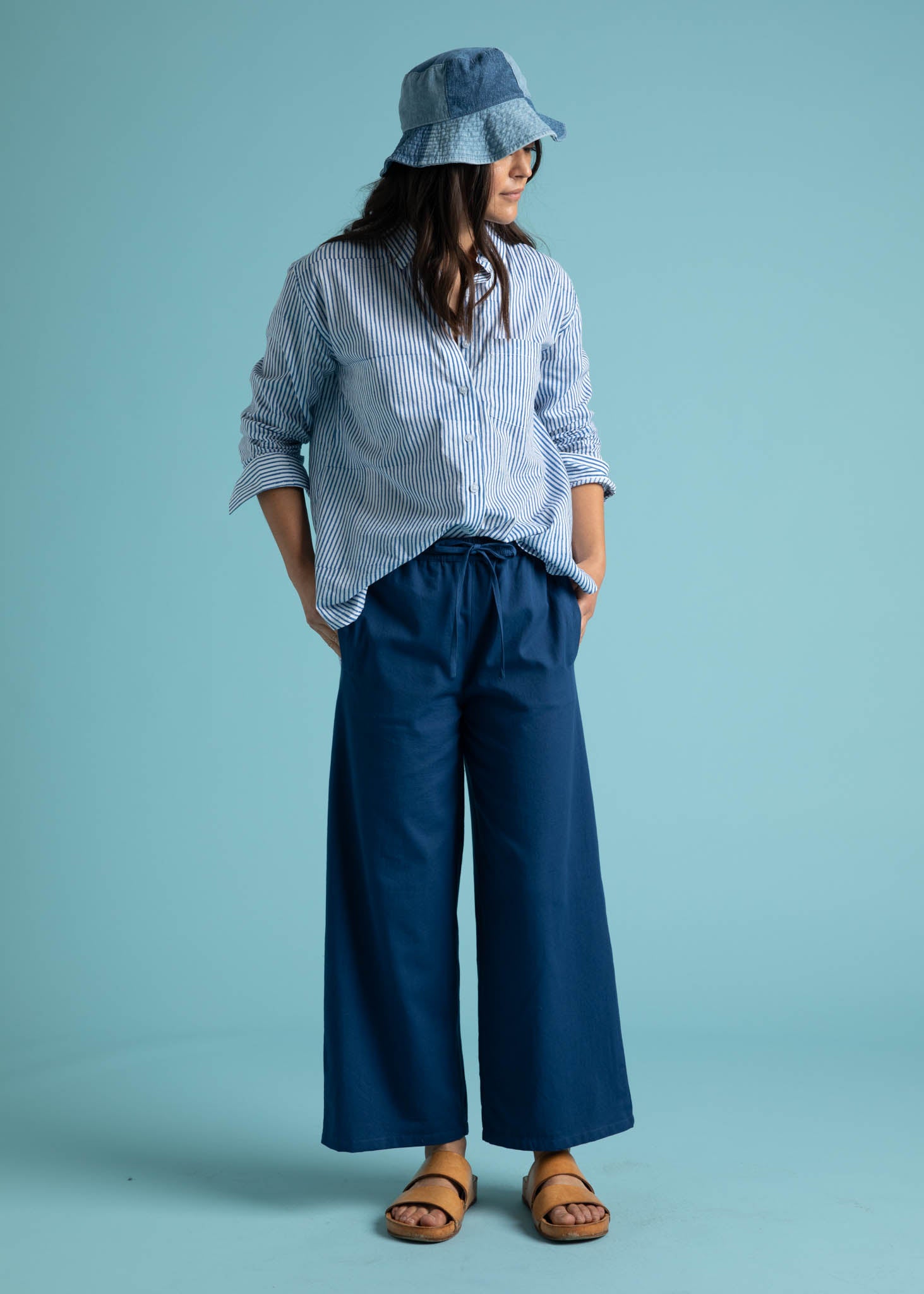 Shore Pant in True Navy featuring a relaxed fit, cropped length, and elastic waist, displayed on a model.