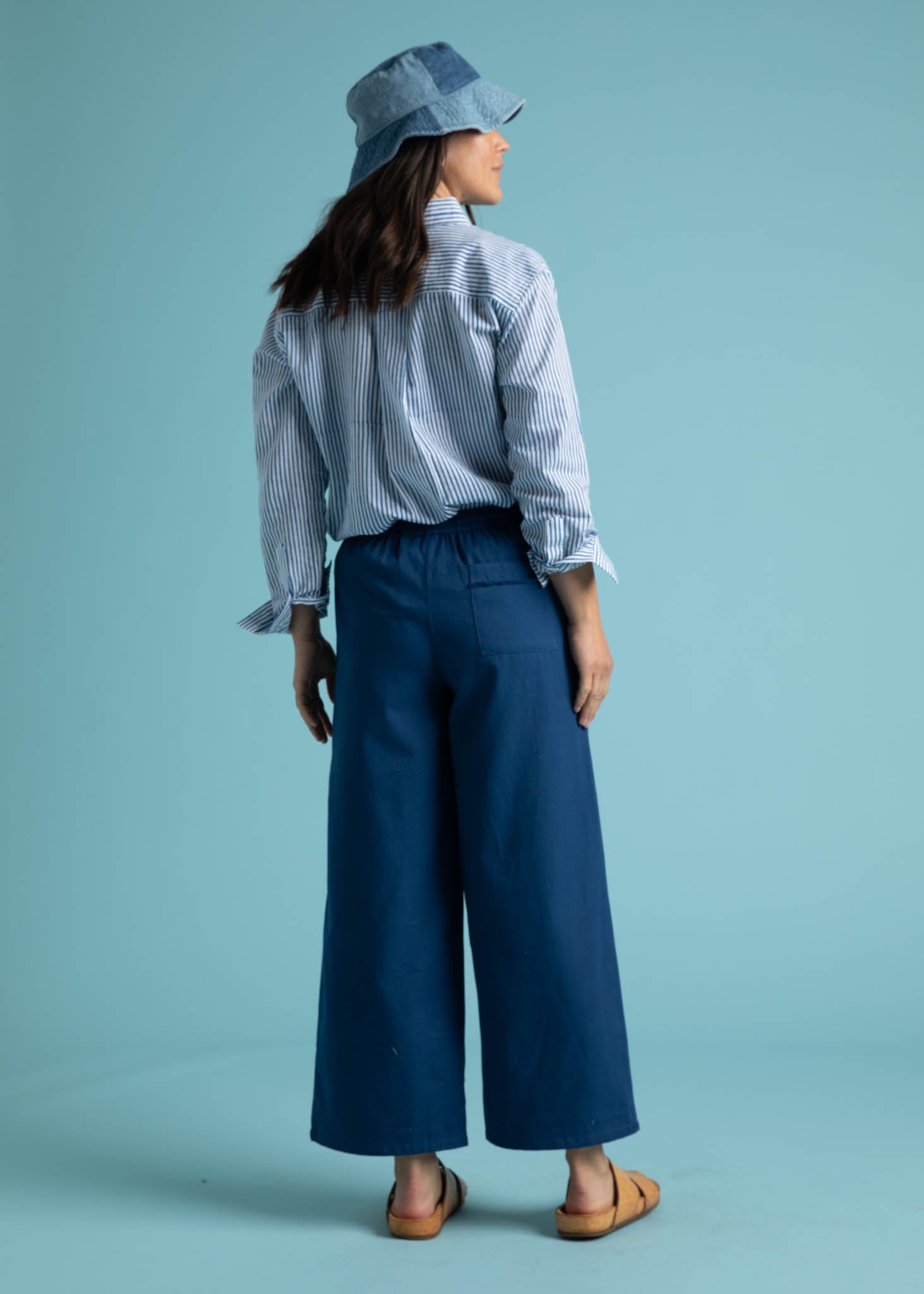 Shore Pant in True Navy featuring a relaxed fit, cropped length, and elastic waist, displayed on a model.