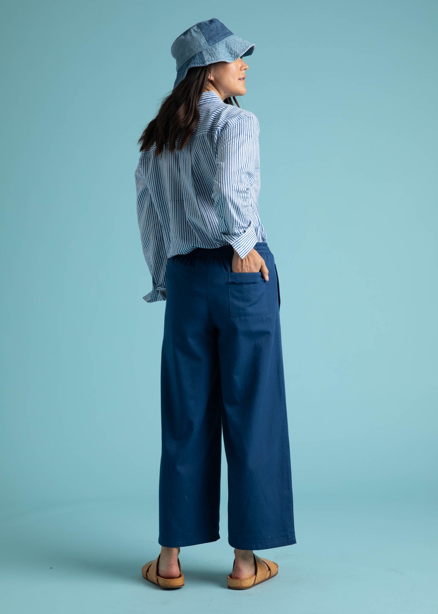 Shore Pant in True Navy featuring a relaxed fit, cropped length, and elastic waist, displayed on a model.