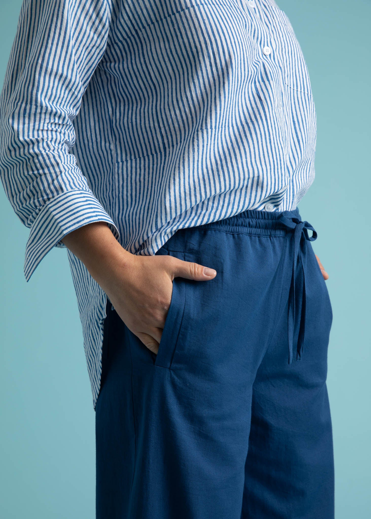 Shore Pant in True Navy featuring a relaxed fit, cropped length, and elastic waist, displayed on a model.