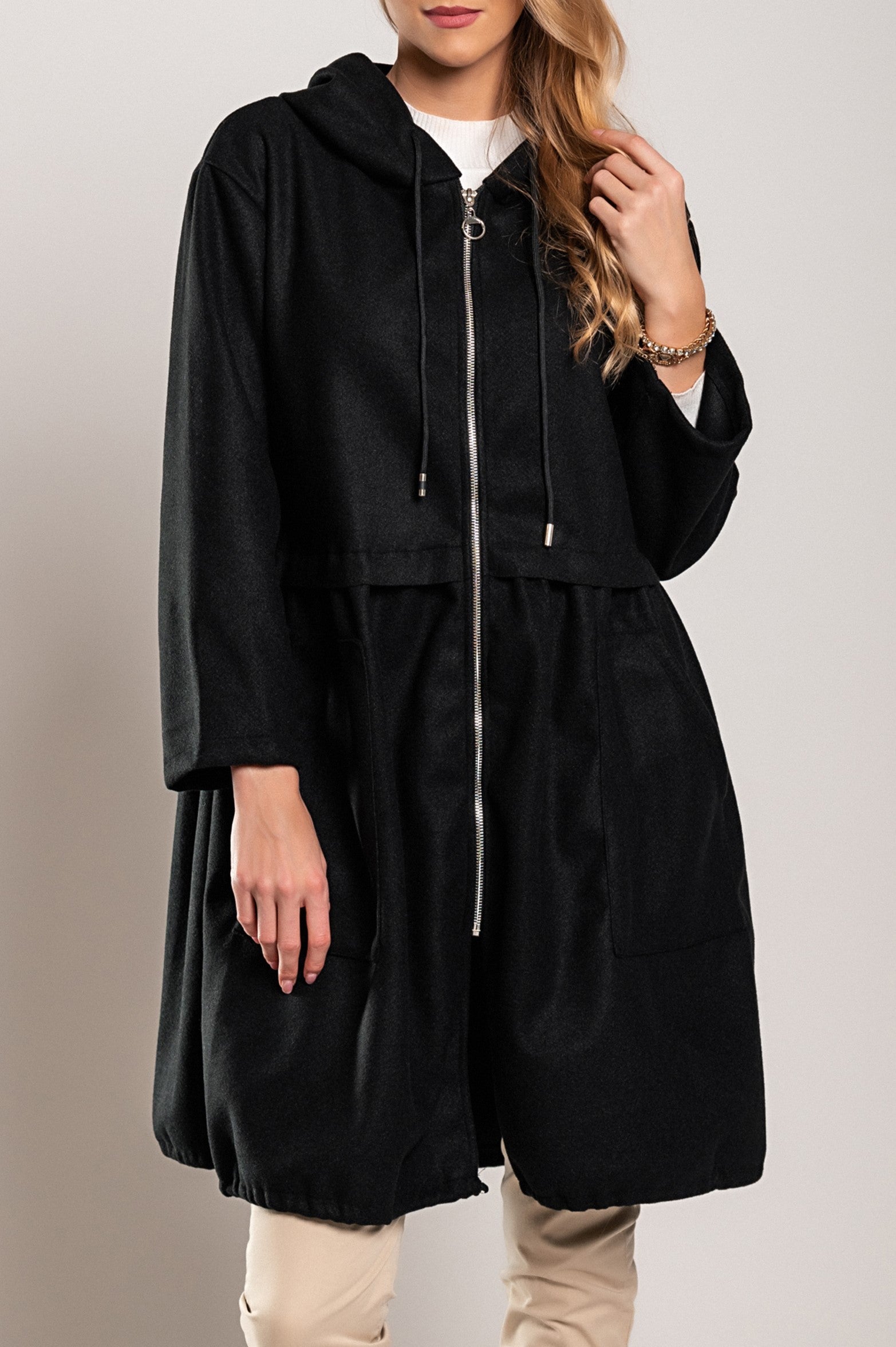 A stylish black short hooded coat featuring a drawstring hood, front pockets, and a zip closure, made from high-quality soft fabric.