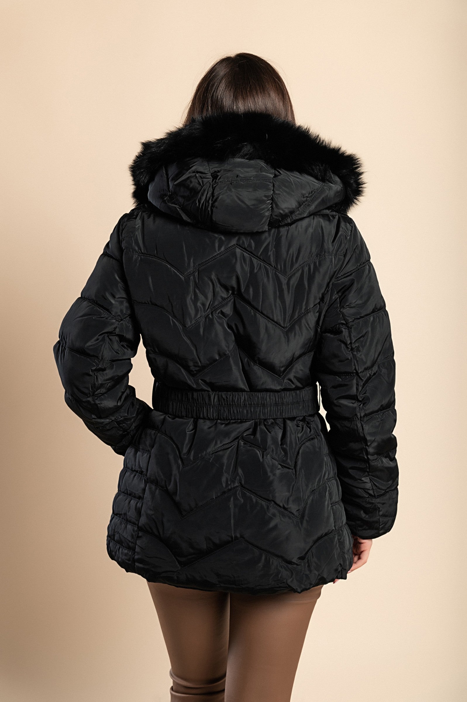 A stylish plus size black padded jacket with a hood and synthetic fur, featuring a high collar, zip closure, and side pockets.