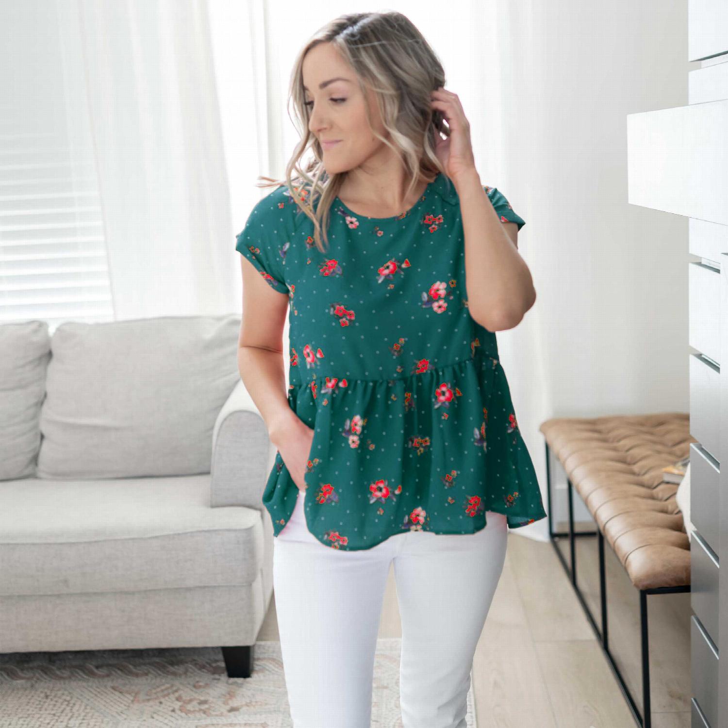 A vibrant short sleeve floral print top featuring a lace-up back detail, perfect for casual outings.