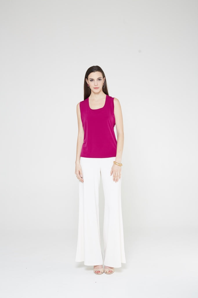 A stylish short tank top with a soft-scooped neckline and wider shoulder straps, perfect for layering under jackets.