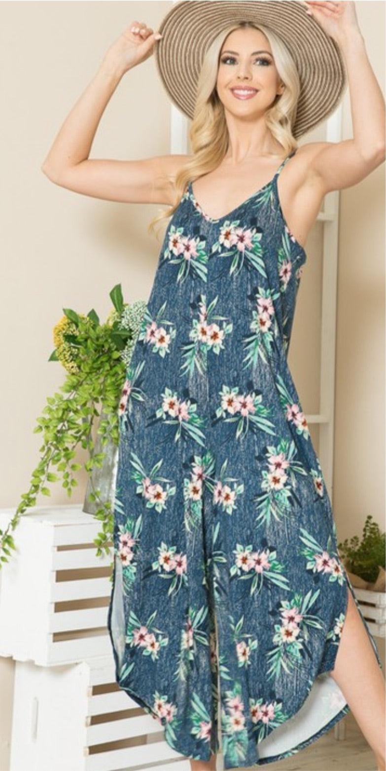 A stylish side slit floral jumpsuit featuring a v-neck design and convenient side pockets, perfect for casual outings and beach days.