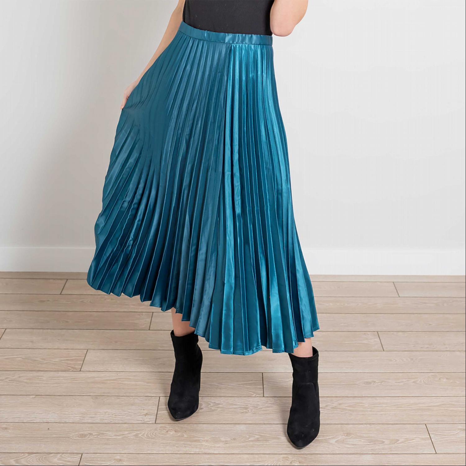 A beautiful side zip pleated silk midi skirt in a soft, elegant fabric, showcasing its pleats and stylish design.