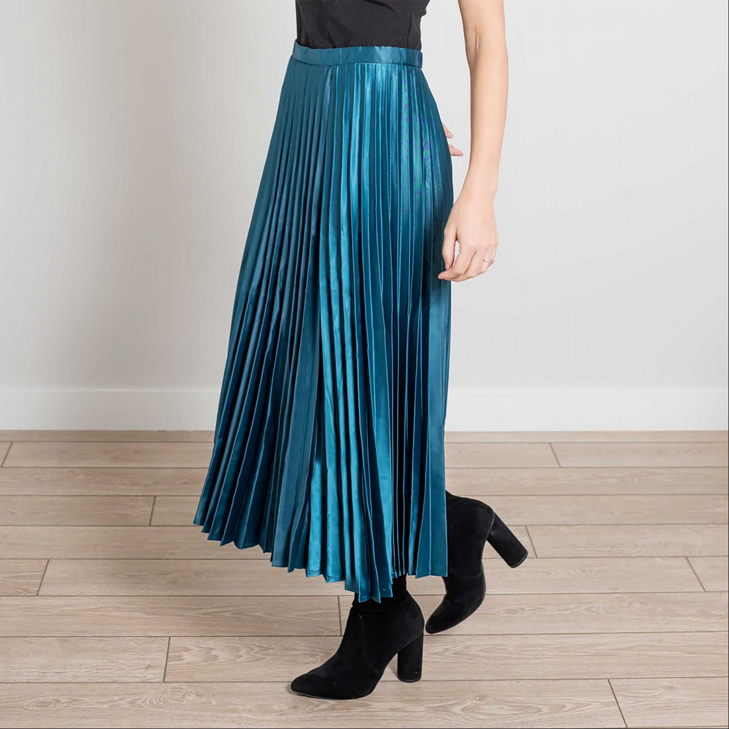 A beautiful side zip pleated silk midi skirt in a soft, elegant fabric, showcasing its pleats and stylish design.