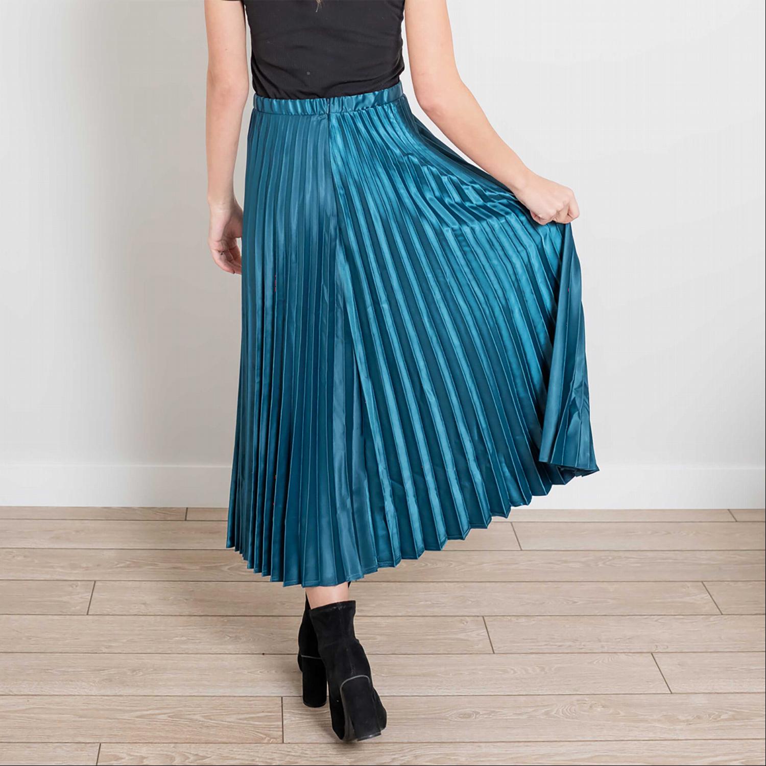 A beautiful side zip pleated silk midi skirt in a soft, elegant fabric, showcasing its pleats and stylish design.