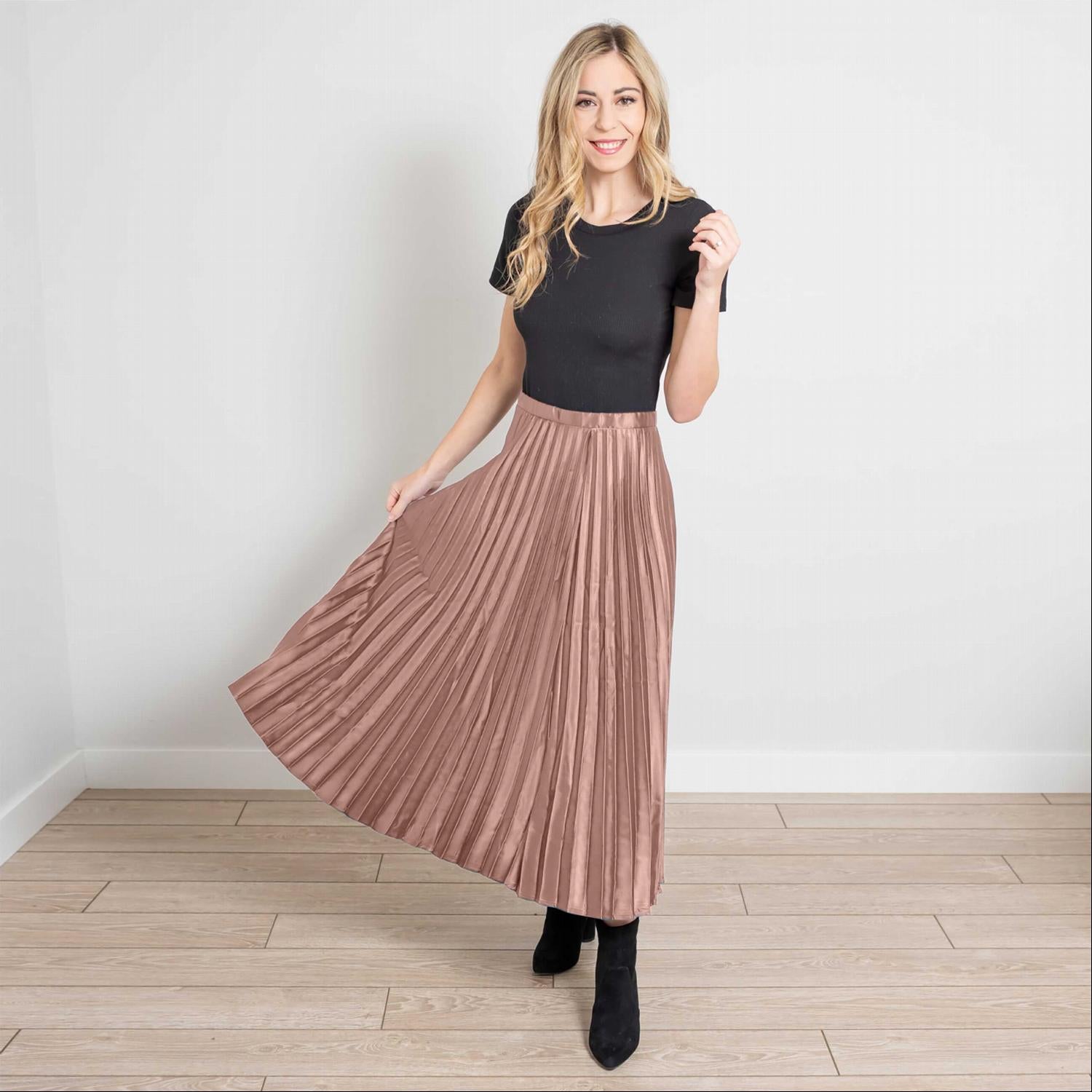 A beautiful side zip pleated silk midi skirt in a soft, elegant fabric, showcasing its pleats and stylish design.